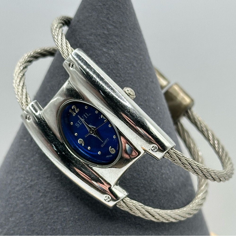 Elegant silver Sevil watch with blue face and cable-style band - needs battery